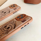 Two phone cases with cartoon character design on a light background