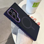 A person holding a Samsung Galaxy smartphone in a luxury matte magnetic black case with orange accents around the camera and edges.