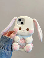 Cute bunny phone case held by a person with a plain background
