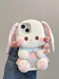 Phone case shaped like a cartoon bunny held by a person against a neutral background