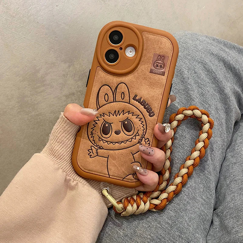 Phone case with cartoon character and braided strap held by a person