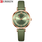 A CURREN brand wristwatch with a green leather band and rose gold case, featuring a green dial with Roman numerals.