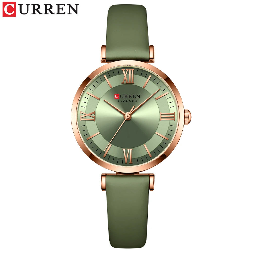 A CURREN brand wristwatch with a green leather band and rose gold case, featuring a green dial with Roman numerals.