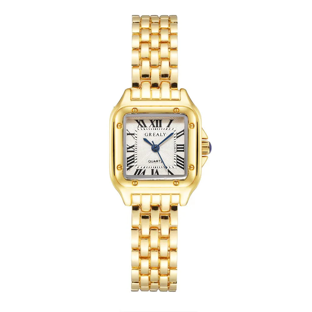 A woman's wristwatch with a gold stainless steel band and a white dial with black Roman numerals. The watch has a square case shape and a bracelet clasp.