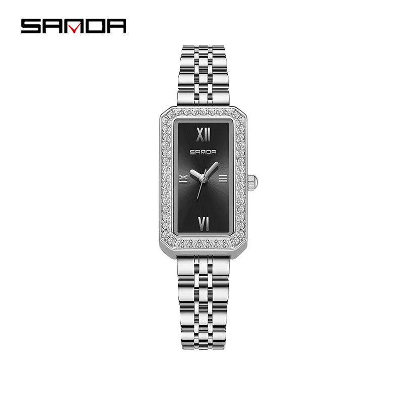 A SANDA brand trendy design women's analog wristwatch with a rectangle dial, encased in a rose gold case with a diamond-like pattern on the bezel, and a brown leather strap. The watch is displayed with a price tag and branding tags.