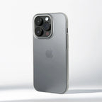 Silver iPhone with Apple logo on a light gray background