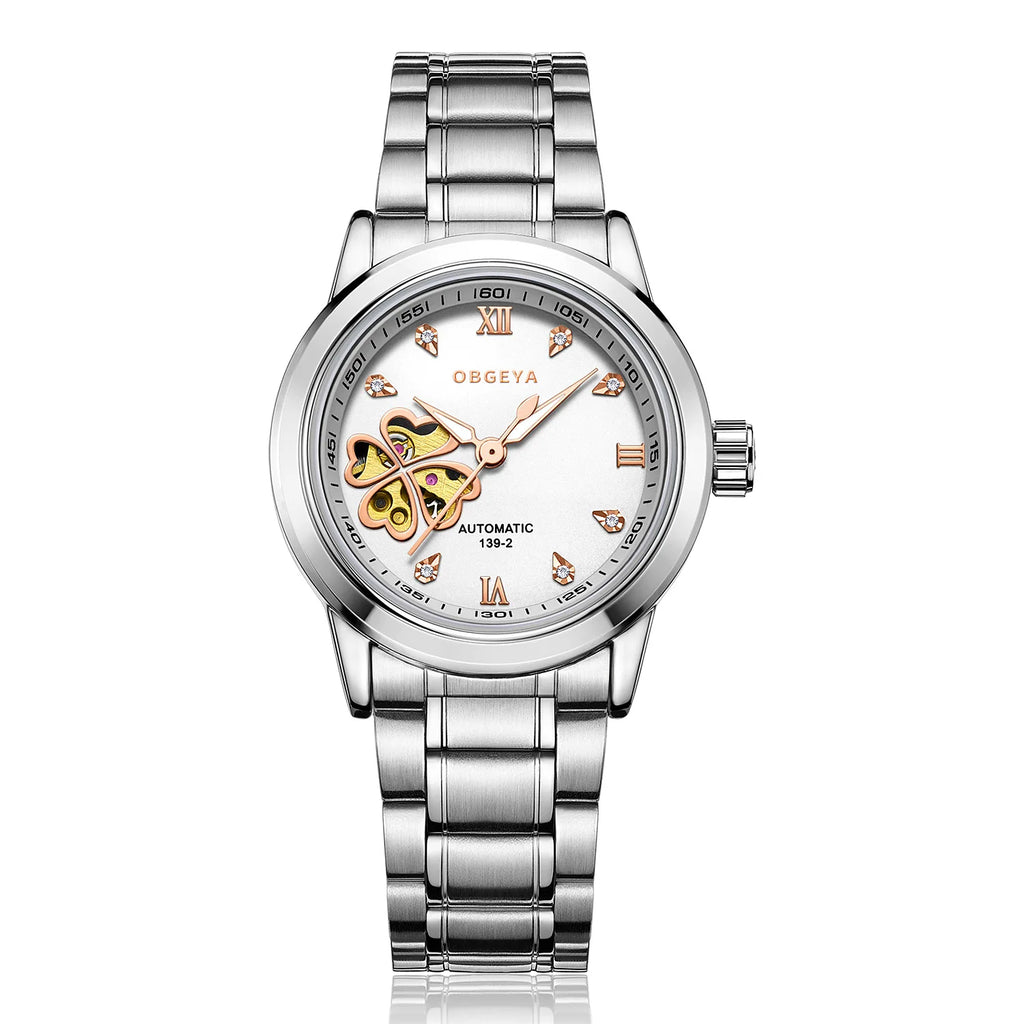A band mechanical wristwatch with a silver alloy case, featuring a white dial with diamond accents and a four-leaf clover design in the center.