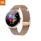 Xiaomi smart watch with a gold-colored metal band and round display showing time and various smart watch notifications.